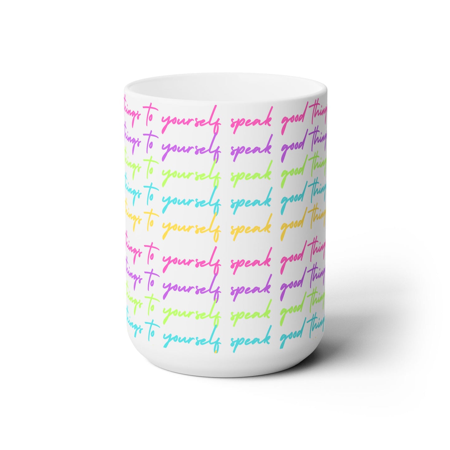 White mug with colorful text on a white background