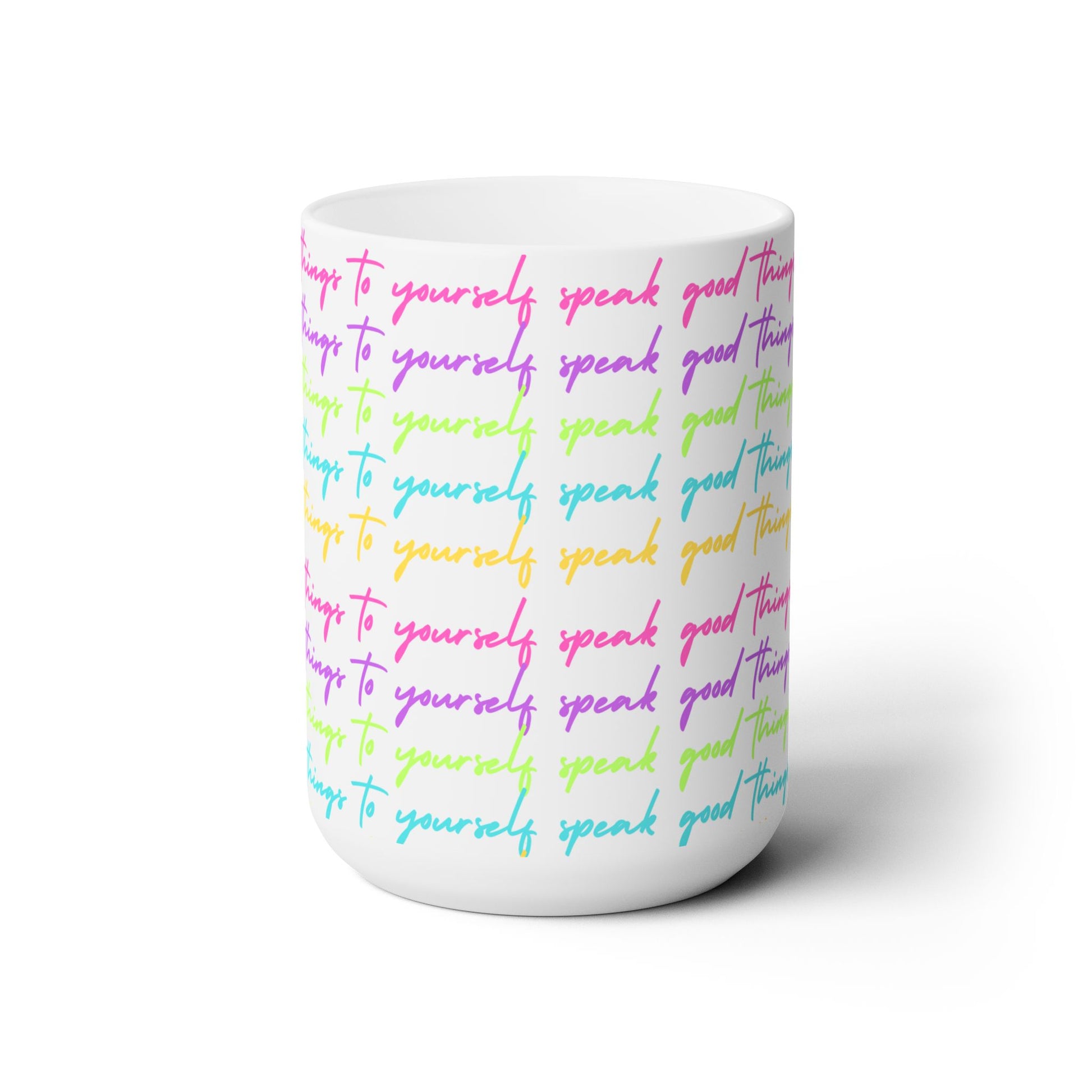 White mug with colorful text on a white background