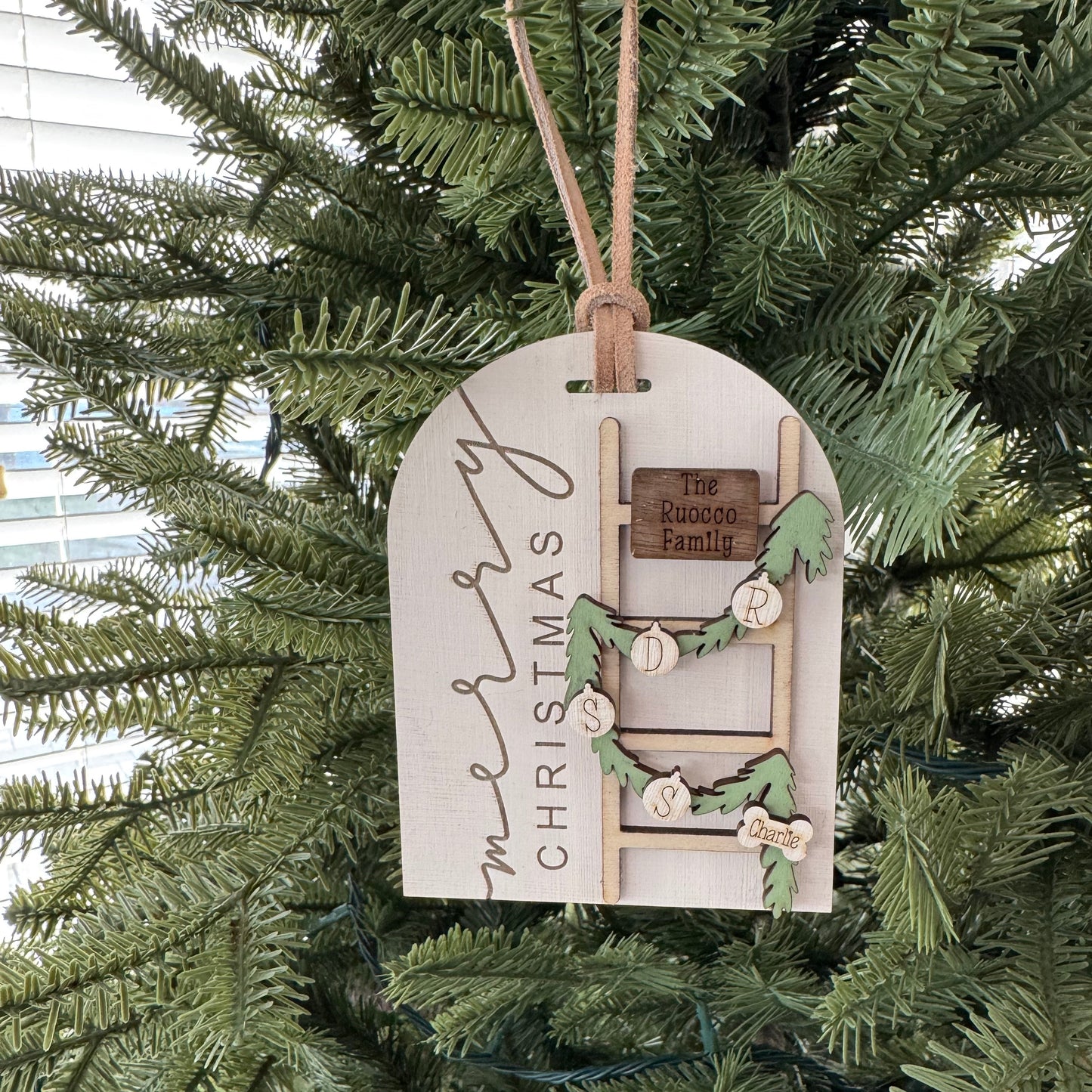 Decorative Christmas tag hanging on a tree