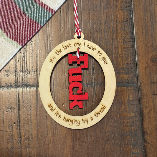 Decorative ornament with text on a wooden surface