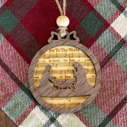 Wooden ornament with musical design on a plaid fabric background