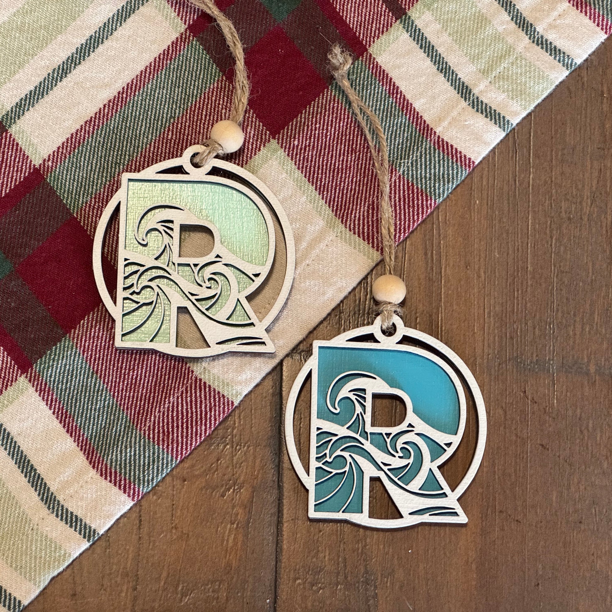 Layered Wave Letter Ornament on a plaid fabric background